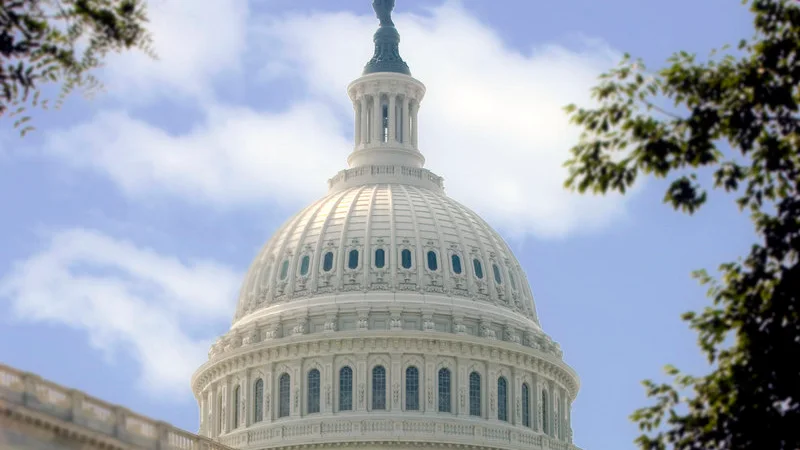 The dome of the United States Capitol under a bright sky